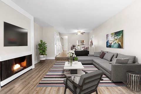 a living room with a fireplace and a couch
